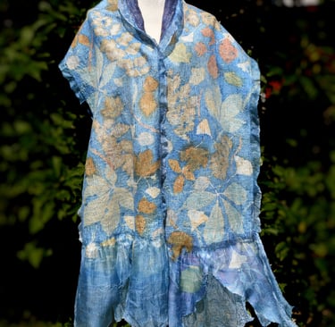 Handmade nuno felted blue silk scarf with botanical print leaf patterns on a mannequin.