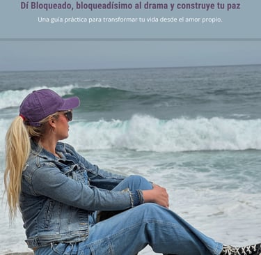a woman sitting on a rock with a hat on