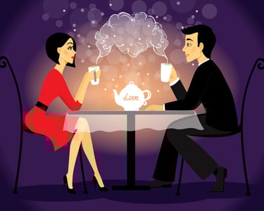 a man and woman sitting at a table with a teapot