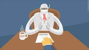 a robot is sitting at a desk with a cup of coffee