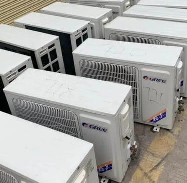 a bunch of air conditioners are lined up in a row