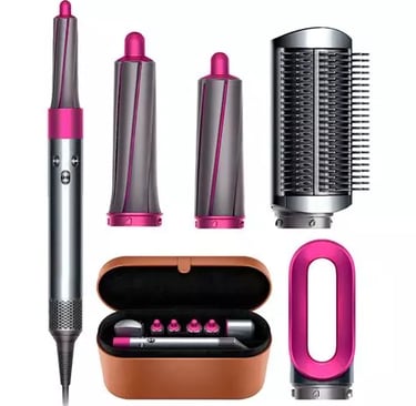 a hair dryer with a pink hair brush and a hair brush