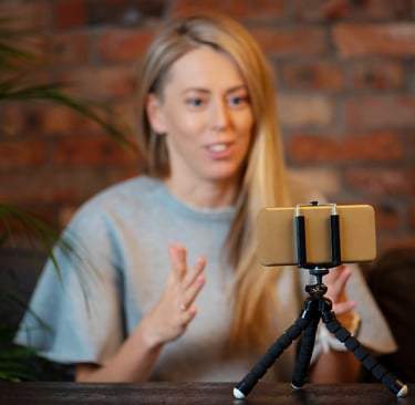 Realtor creating video content for social media to engage buyers and sellers online.