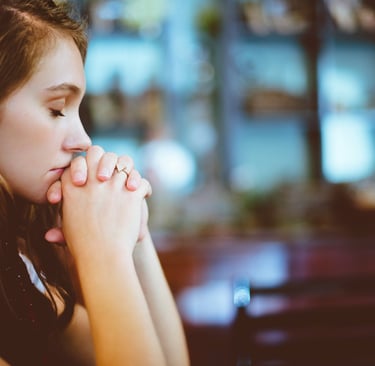 young girl praying