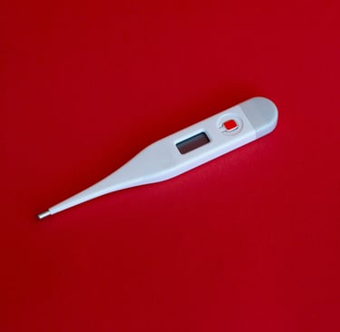 a thermometer against a red background