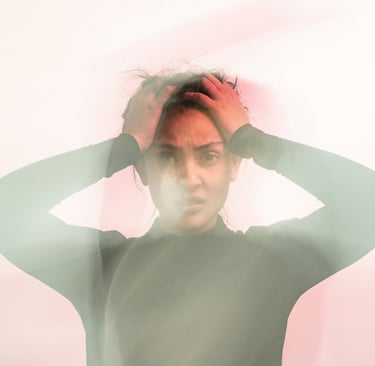woman holding her head in stress