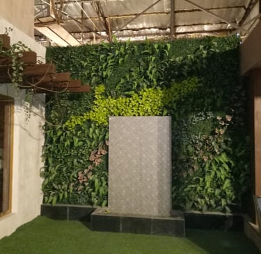 a room with a green wall and a fountain