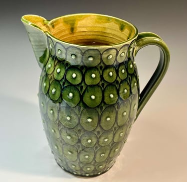 Green glazed pitcher with dots