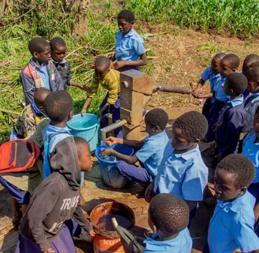 kids using well in Africa