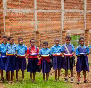 school children with food in Malawi