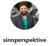 a man with a beard and a green shirt