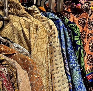 a variety of clothes and accessories on display in a store