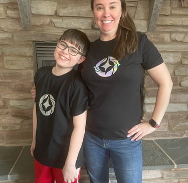 Erin and her son, Felix in Disney Lorcana shirts