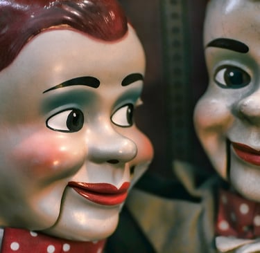 Two dolls looking at each other