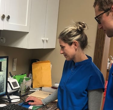 Our dental team reviewing x-rays of a patient's teeth