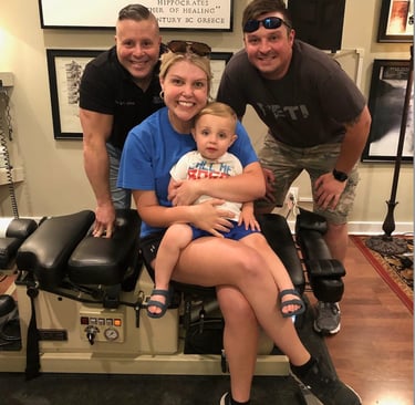 Dr. Scott Albano with a happy family after a chiropractic session