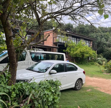 a white car parked in front of a house