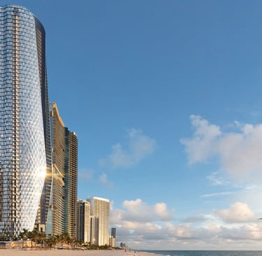 a beach with a large building in the background