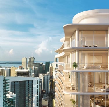 a tall building with a large balcony and a view of the ocean