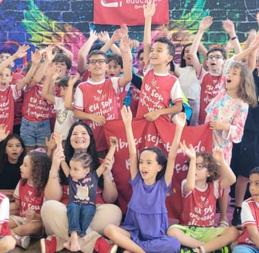 a group of children and adults posing for a photo