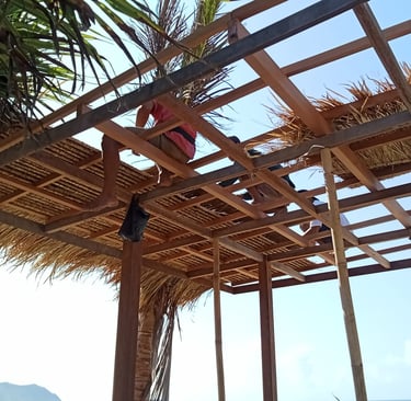 a person installing a reed roof