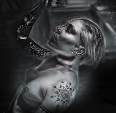 a woman with tattoos on her chest and arm