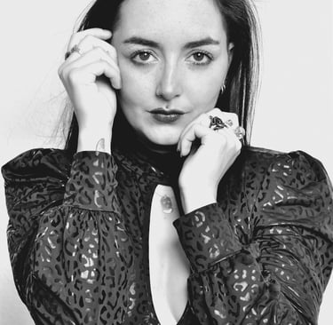a woman in a black dress with a white background