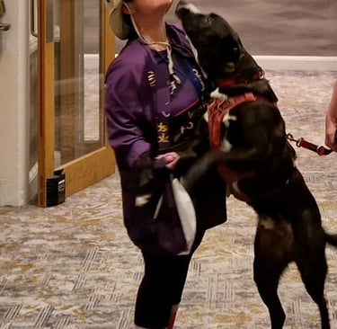 Claire being greeted by her special friend Patch