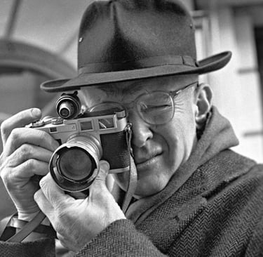 Henri Cartier-Bresson with his Leica