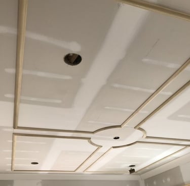 a ceiling with a ceiling fan and a ceiling fan