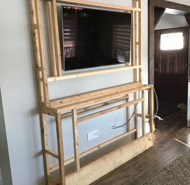 a television screen mounted on a wall in a living room