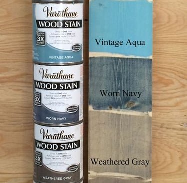 a stack of paint and woodworking supplies for sale