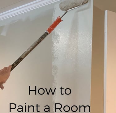 a person painting a room with a paint roller
