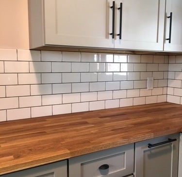 a kitchen counter top with a wooden counter top