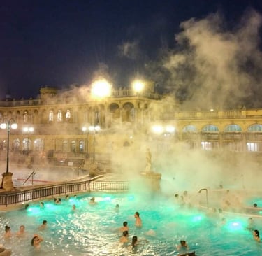 a group of people in a pool with steam coming out of the water