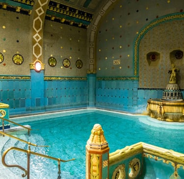 a pool with a fountain in the middle of it