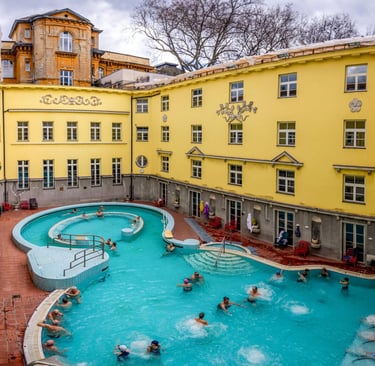 a pool with people swimming in a large pool