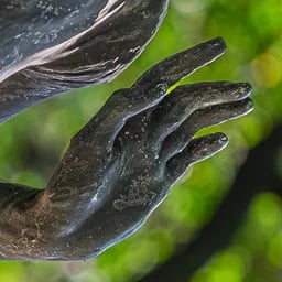 Close up on the hand of the Spring statue.