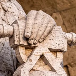 Close up on the hand of the Engineering statue.