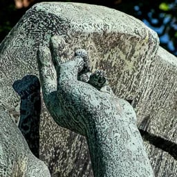 Close-up of angel’s left hand 