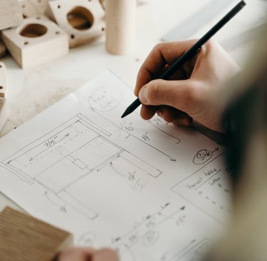 a person is holding a pencil and drawing a picture