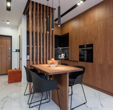a dining room with a table and chairs