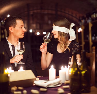 Couple Wine Tasting, female has blindfold on