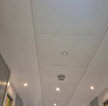 MF ceiling meeting a suspended ceiling