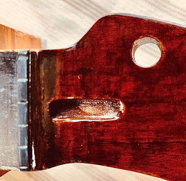 Magnified Repair after many layers of colors and finish have been applied