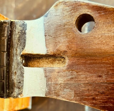 Magnified Wood Epoxy repair on a Curly Walnut Tele Headstock