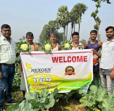 a group of men standing in a field with a welcome sign