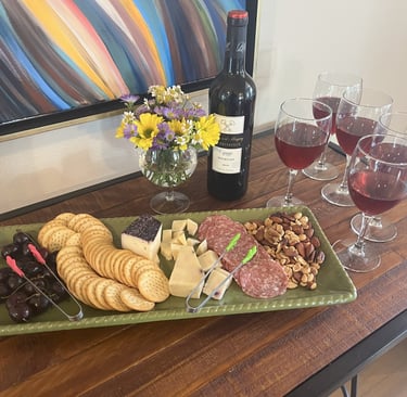 a table with wine glasses and wine glasses