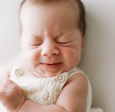 Baby stretching during calm newborn photography session in Adelaide Hills