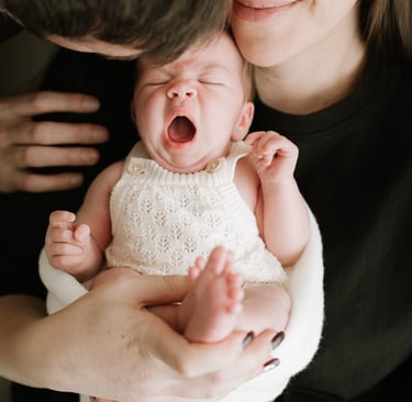 Family cuddling newborn during Adelaide newborn photography session